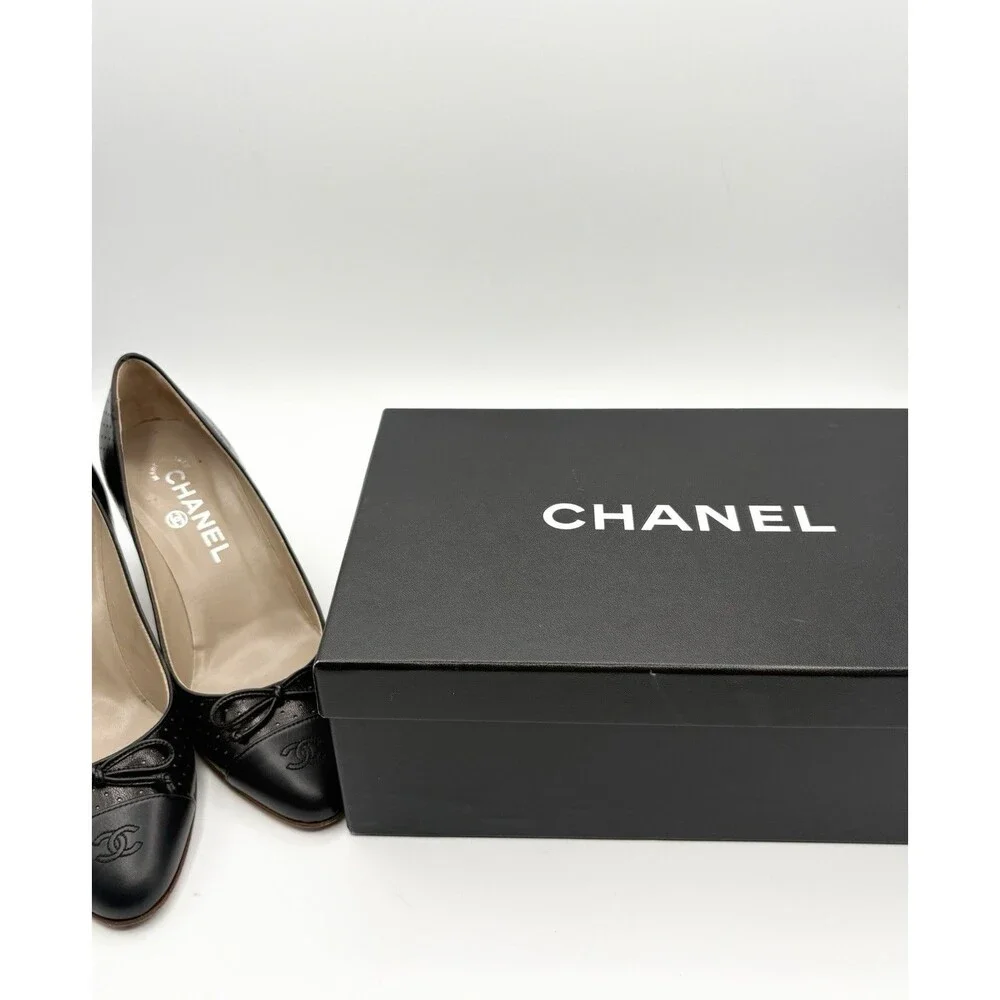 Chanel Black Perforated Leather Heels w/ CC Cap Toe & Bow Accent Size EU 36.5
